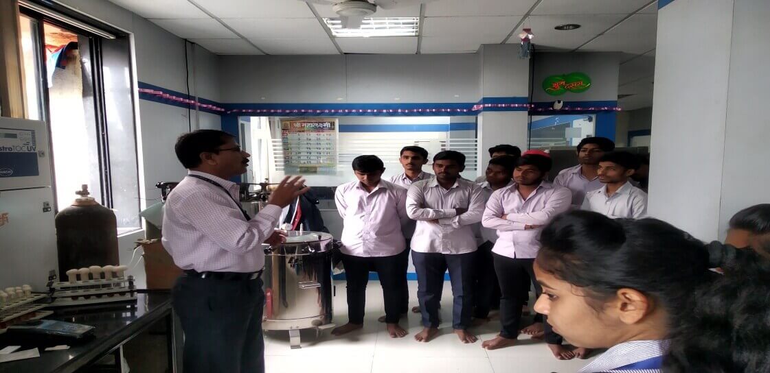 Students listening demonstration of chemist, PCP